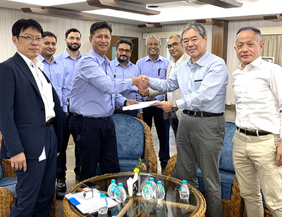 Representatives from Primetals Technologies and AMNS India shaking hands during the contract signing ceremony