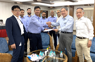 Representatives from Primetals Technologies and AMNS India shaking hands during the contract signing ceremony